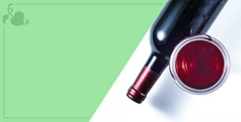 Glass and bottle of red wine on a white background. Place for text.