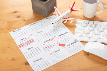 Obraz premium Planner Calendar and agenda reminders, work from home. for plan daily meeting and note holiday trip in diary at office desk. 2023 calendar reminder concept.