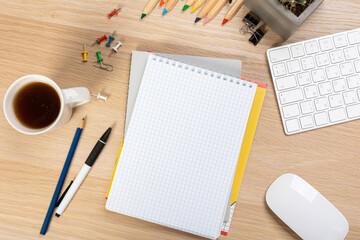 Notebook mockup with school stationery on a wooden table. back to school concept. Blank notepad with copy space. list of goals and plans for new year 2023