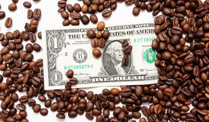 Coffee grains with dollar on a white background.