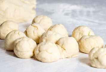 Unleavened dough on a sourdough table with flour.The concept of making homemade healthy baked goods.