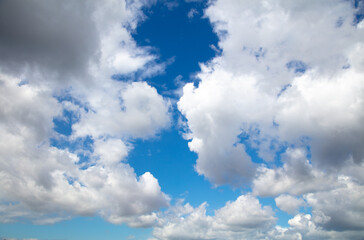 Naklejka na ściany i meble White clouds on the blue sky