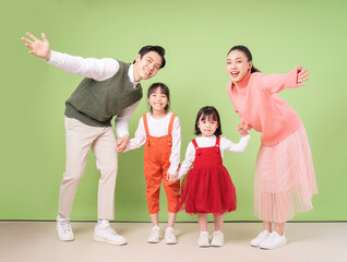 Fototapeta premium Image of young Asian family on background