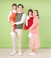 Fototapeta premium Image of young Asian family on background