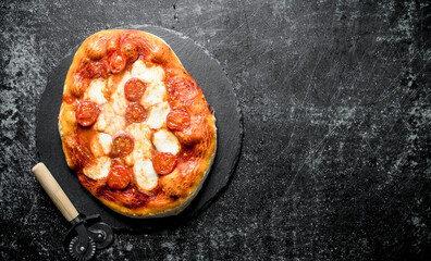 Homemade pizza on a stone Board.