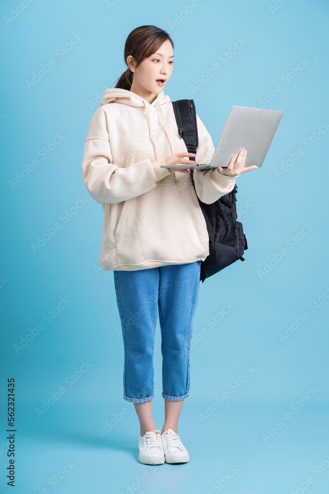 Sticker Full length photo of young Asian student girl on background