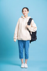 Fototapeta premium Full length photo of young Asian student girl on background