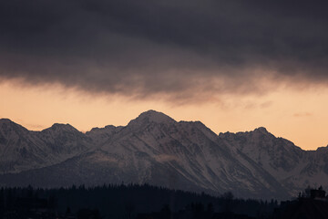 Mountain peaks covered with snow at sunset