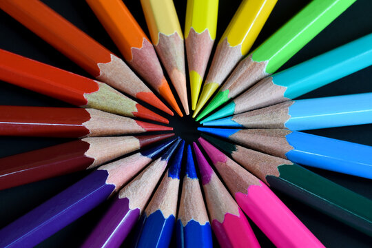 Color pencils isolated on black background. Close up