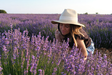 Happy woman breathing in a lavender field