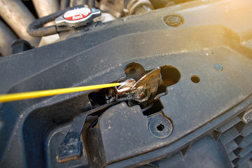 Lubricating car hood lock, spray and cleaning rusty hood lock of car, spraying grease, lubrication...