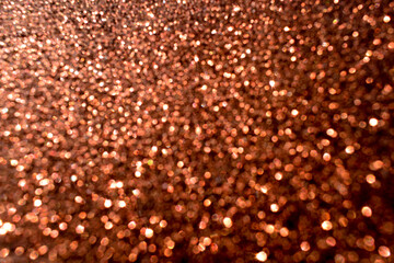 Brown bokeh shiny light sparkle glitter background.  New Year, Christmas and all celebration background concept. 