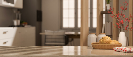 Copy space on tabletop with and decor over blurred kitchen and dining room in the background