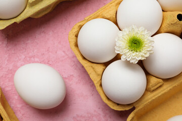 Concept of spring, eggs with flowers, top view