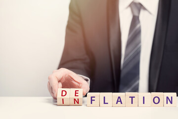 Wooden cubes with words, business inflation and deflation concept