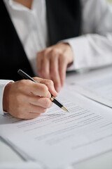 Closeup image of social worker signing document - obrazy, fototapety, plakaty