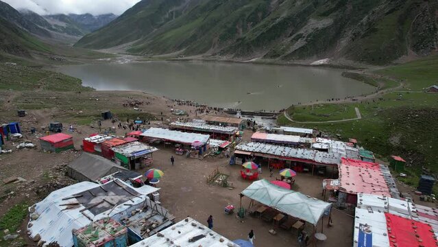 Saif ul Malook Lake and Surrounding Mountains: A Drone's Eye View.  Experience the natural beauty of Pakistan with this drone video of Saif ul Malook Lake and its surrounding mountains. The lake, loca