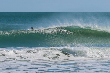 Fototapeta premium Surfing at Spanish House in Sebastian Inlet state park in Florida