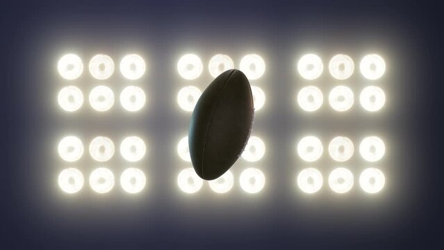 Super bowl football Spinning on floodlight background