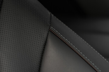 Part of leather car seat. Macro. Сar leather interior details. High angle view of modern car...