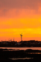 wind turbine at sunset. the evening sea tinged with twilight.
