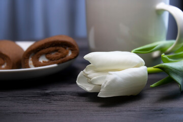white flower with coffee and cake