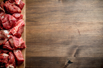 Sliced raw beef on a cutting Board.
