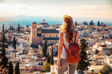 Woman looking at Granada city panoramic view