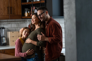 A calm family moment at home. Family enjoying their time together, bonding, showing love, care and support.