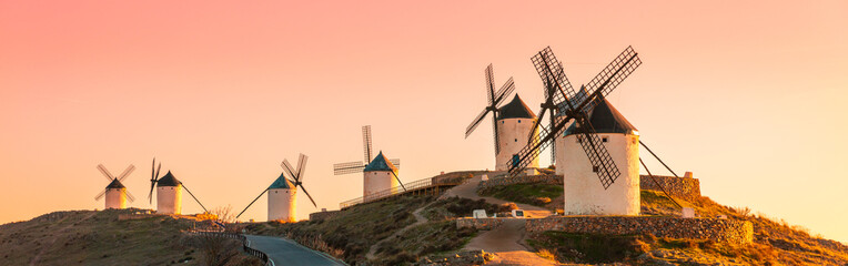 don quixote-panoramic windmills at sunset in Conuegra,  Castile in Spain - obrazy, fototapety, plakaty