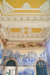 Porto, Portugal - 25.12.2022: Sao Bento Railway Station Breathtaking Picturesque Interior View of Traditional Azulejos Tiles with Tourists. High quality photo