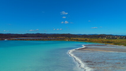 Top down aerial view over natural texture - abstract industrial lake water patterns. Turquoise waternature poluttion