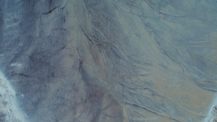 Obraz premium Top down aerial view over natural texture - abstract industrial lake water patterns. Turquoise waternature poluttion