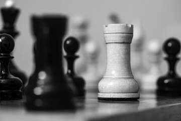 chess pieces on a chessboard, black and white photo
