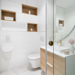 White bathroom with wooden shelves