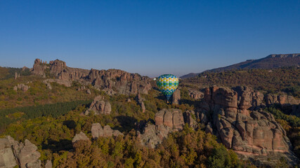 Aerial view of hot air balloon at Belogradchik rocks in the autumn, November 2019