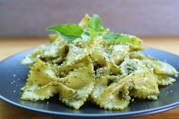 Closeup of Delectable Bow-tie Pasta or Farfalle in Pesto Sauce