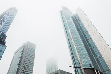 Fototapeta na wymiar Modern foggy Warsaw city with office and business buildings. Economy and real estate