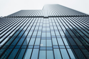 Fototapeta na wymiar Beautiful modern office steel glass building. Business, finance and construction