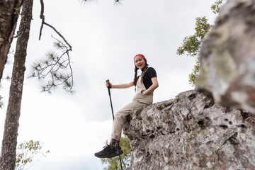 Young woman with backpacker enjoying the view