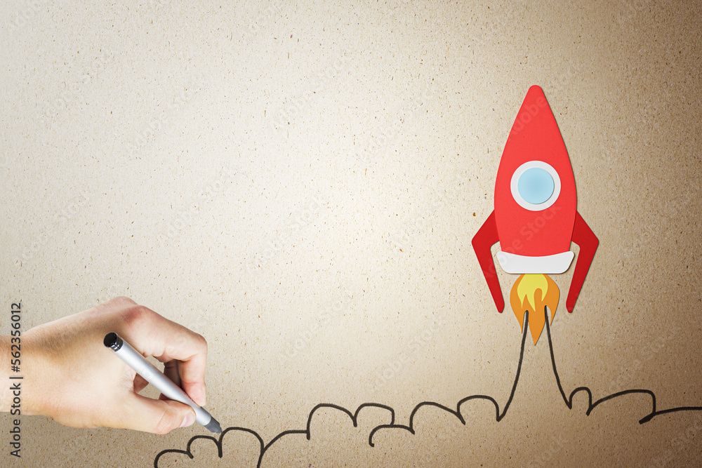 Aufkleber business project launch, startup and creative idea concept with taking off red rocket and human hand