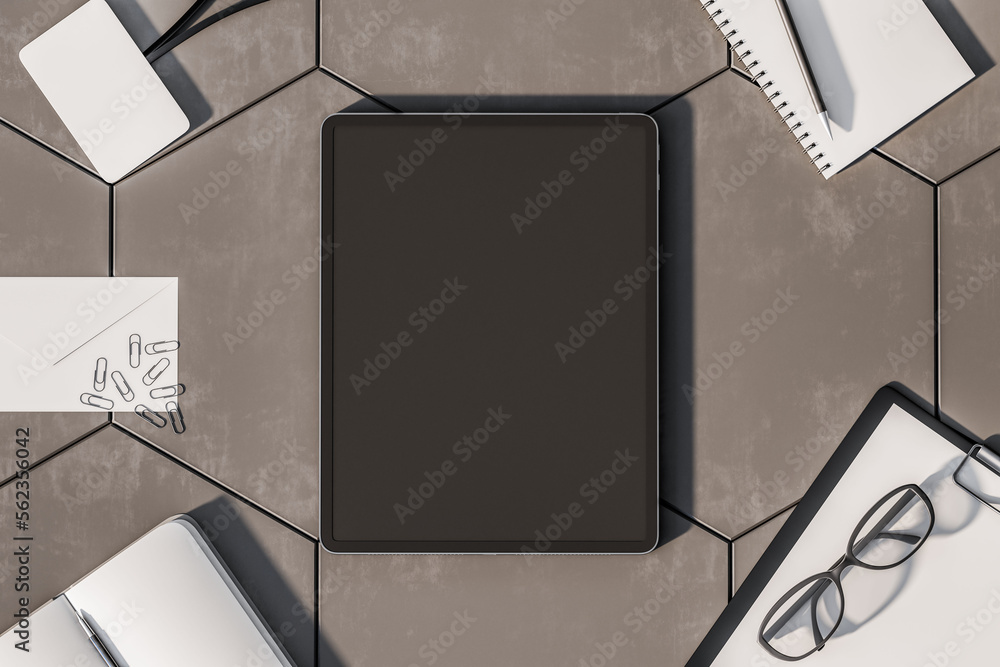 Poster Top view on blank dark digital tablet screen with space for your advertising logo or text on grey concrete tiles surface with office tools and glasses. 3D rendering, mock up