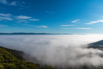 Hills above mist - view from Slavenska vyhlidka in CHKO Broumovsko in Czech republic