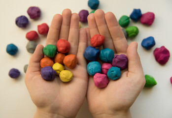 making ball with colorful dough for children's activity. play in   plasticine .