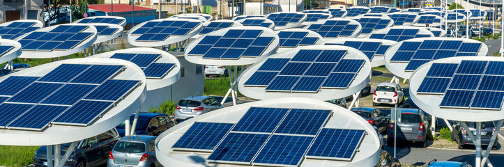 solar power plant with big antennas on a parking for charging electrocars, car energy of future