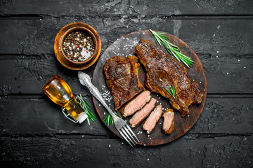 Grilled beef steaks on a cutting Board.