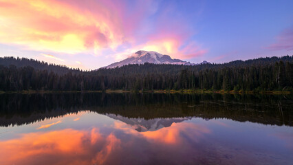 Mt Rainier reflected in Reflection Lake at purple sunset in Washington's Mount Rainier National Park