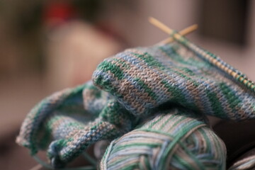 cosy stay at home evening with relaxing hobby, knitting, shallow depth of field