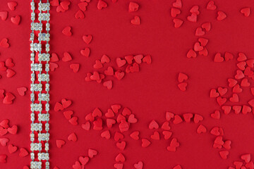Beautiful diamond bracelet on a red monochromatic background, Valentine's Day 