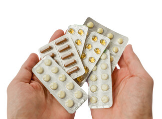 Lot of tablets pill in hands of the patient isolated on transparent